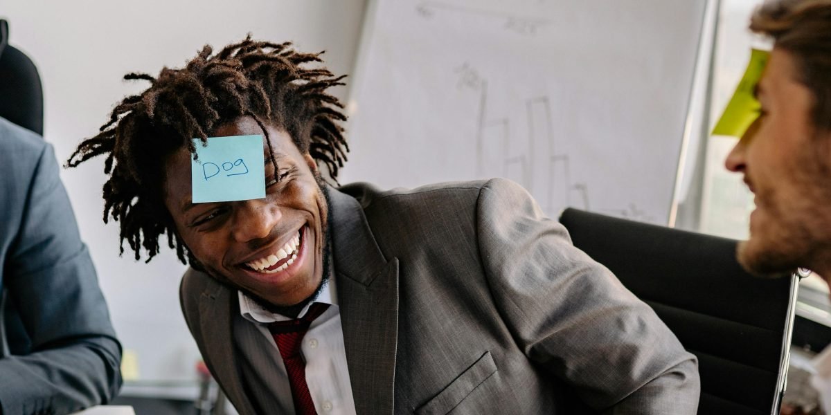 Employees engaged in a fun, spontaneous game at work, promoting natural connection.