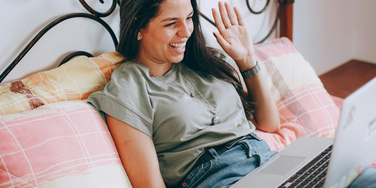 Remote team members connecting and laughing during a virtual free play session.