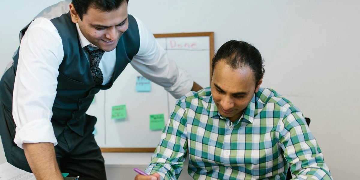 A manager actively listening to and supporting a team member, fostering a culture of trust and psychological safety.