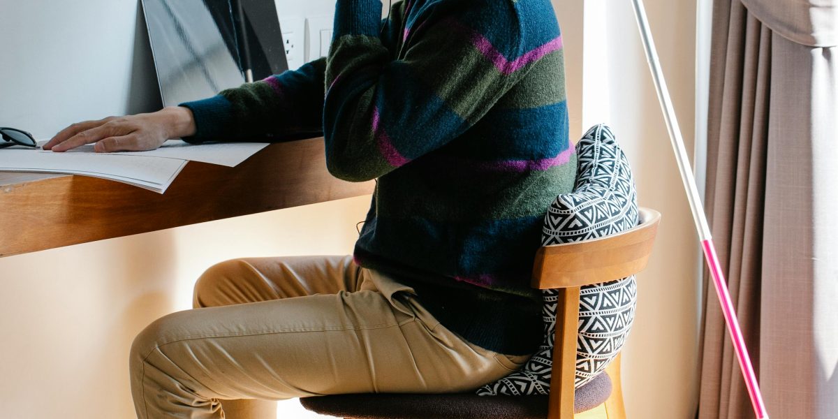 A person working remotely, reflecting the potential disconnect and isolation that can arise in distributed teams.
