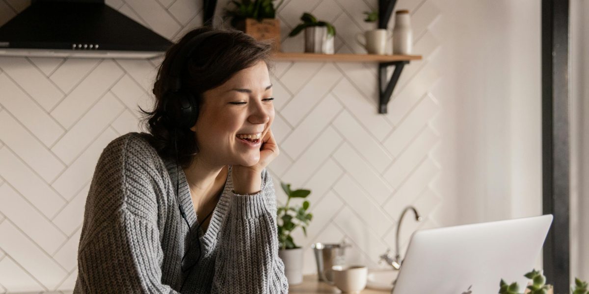 People enjoying a virtual team building game or discussion on a video call, emphasizing connection in remote and hybrid settings.