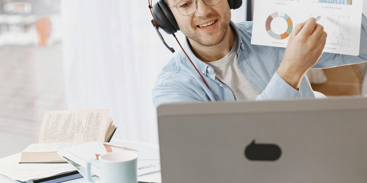 A diverse group of remote team members smiling and actively collaborating during a video conference call, fostering connection across distances.