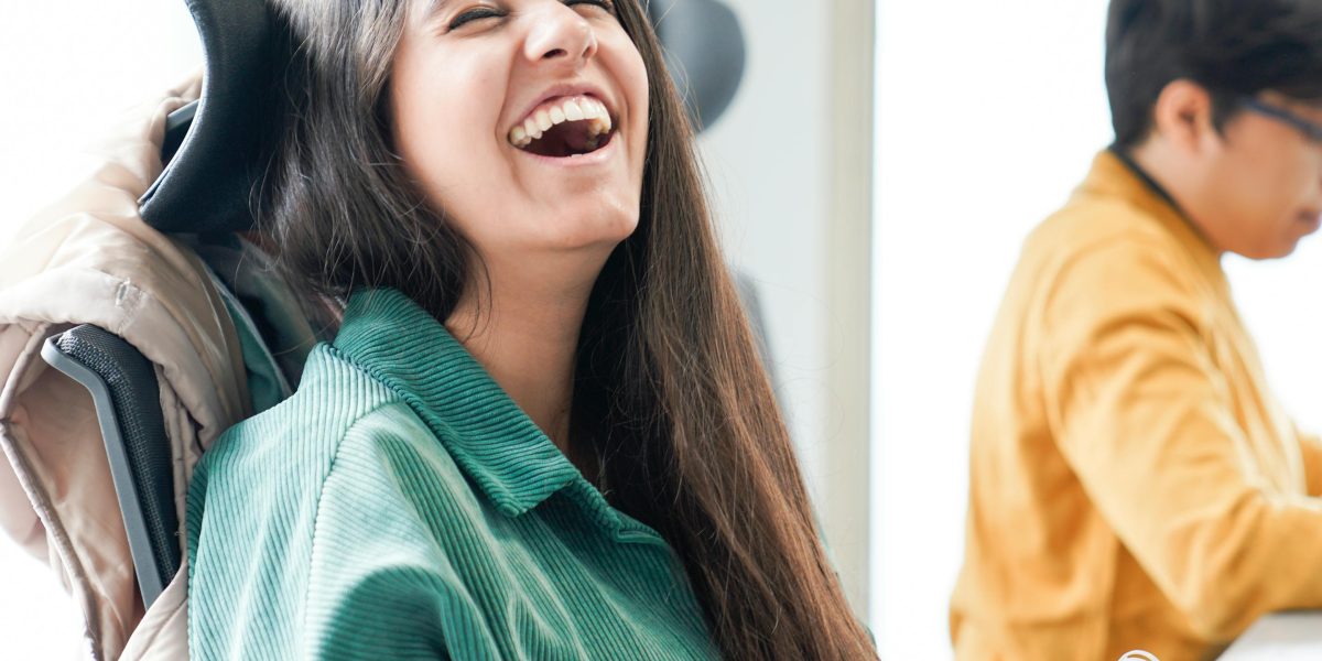 Team members sharing a laugh, highlighting the morale-boosting aspect of games.