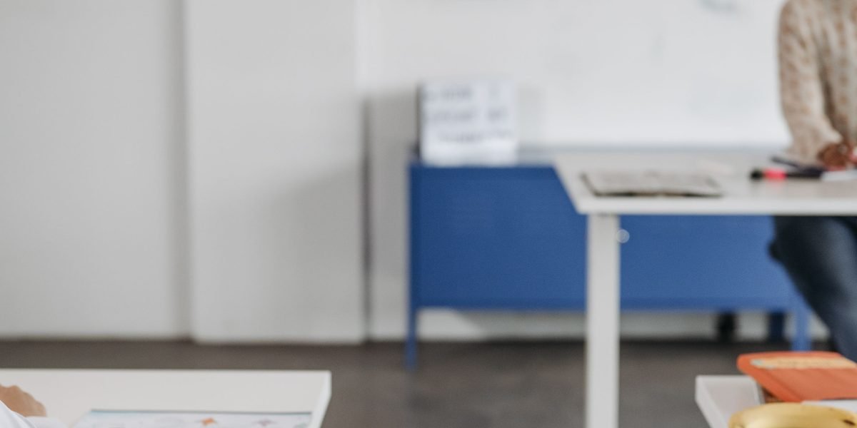 An engaging teacher facilitates a fun, interactive learning game with students in a classroom setting.