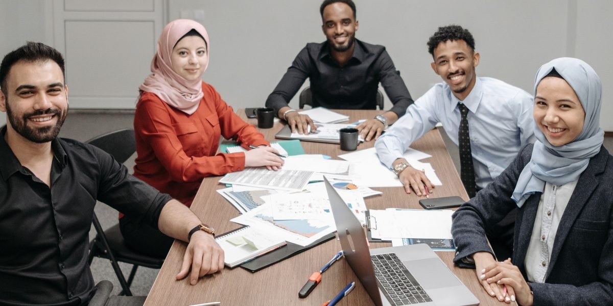 Diverse individuals connecting virtually through video calls, illustrating remote team communication and bonding.